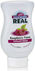 Reàl Infused Exotics Raspberry Syrup bottle pour highlights convenient use.