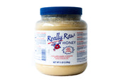 Really Raw Honey bottle on a kitchen counter, pure unheated sweetness.