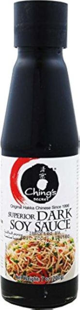 Red Rickshaw Chings Dark Soy Sauce bottle on pantry shelf for Asian cooking.
