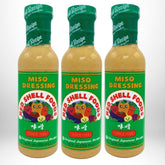 Red Shell Miso Dressing 12-oz bottle trio on shelf, ready to elevate salads.