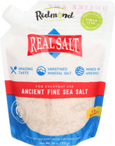 Redmond Real Salt ancient fine sea salt pours, highlighting delicate sweetness for cooking.