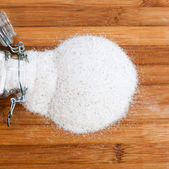 Redmond Real Salt on kitchen counter evokes everyday flavor enhancement for vegetables and meats