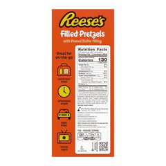 Reese's Filled Pretzels nuggets closeup, golden crunch with smooth peanut butter center.