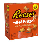 Reese's Filled Pretzels pretzel-shell closeup, crispy texture with creamy peanut butter filling for a tasty snack.