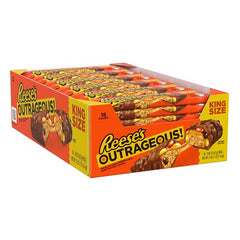 Visible caramel and peanut butter swirl inside Reese's Outrageous bar for a crave-worthy bite.