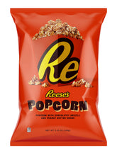 Reese's Popcorn with chocolate drizzle visible in the bag, ready to share