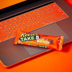 REESE'S TAKE 5 whole-peanuts visible, adding satisfying crunch.