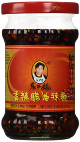 Ren Dao Mei spicy chili crisp bottle enhances noodles with rich, smoky heat.
