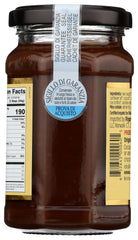 Close-up of glossy hazelnut spread texture; premium ingredients shown.
