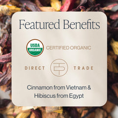 Rishi Cinnamon Plum herbal tea brewing in a mug with rich color.