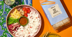 Roland Foods wide rice noodles served in a comforting bowl of soup.
