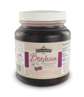 Royal Harvest Northwest Noire cherries bottle pour, ideal for cocktails and garnishes.