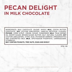 Russell Stover milk chocolate-dipped pecans in glossy coating.