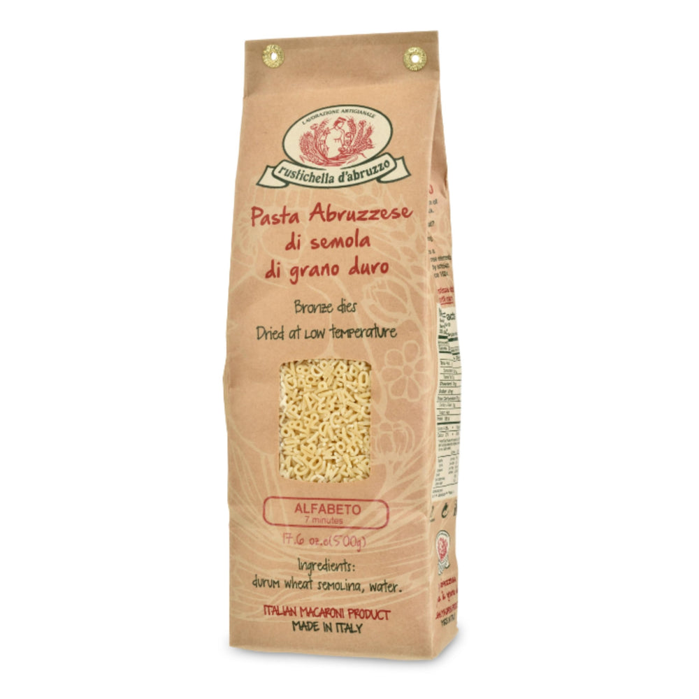 Rustichella d'Abruzzo Alfabeto pasta in brown bag for quick weeknight meals.