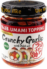 S&B chili oil with crunchy garlic in a jar front, enriching meals with texture.