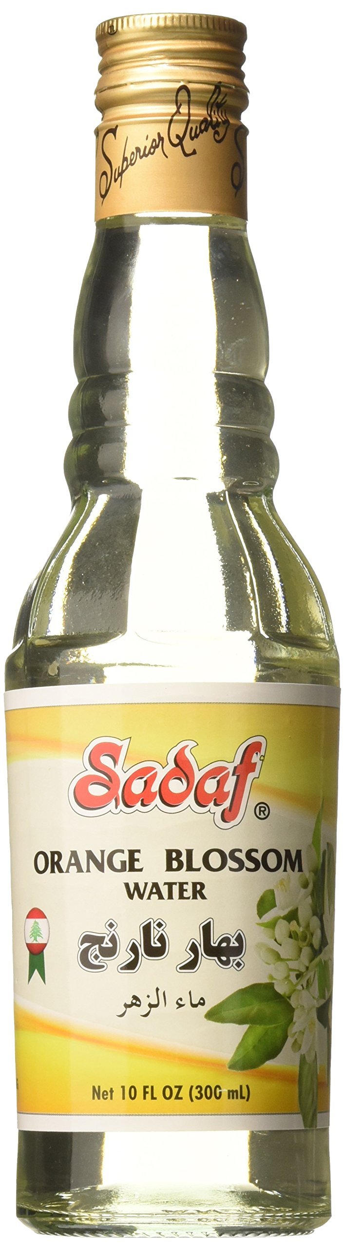 Pouring Sadaf orange blossom water into batter to flavor pastries.