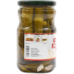 Sadaf Spicy Dill Pickles accompany sandwiches for a tangy, crunchy condiment.