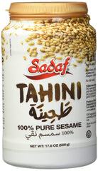 Sadaf tahini paste jar close-up, smooth texture ideal for hummus.