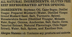 Closeup of Salt Lick Original BBQ Sauce glass bottle with classic label.