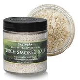 Saltverk birch smoked sea salt bottle on kitchen shelf, premium flavor ready to finish dishes.