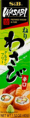 S&B Wasabi tube beside sashimi highlights sharp heat for dipping.