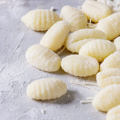 Sanniti gnocchi tomato-sauce-dish plated with red sauce