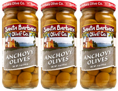 Santa Barbara Olive Co anchovy stuffed green olive 3-pack on a tasting board