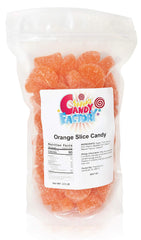 Sarah's Candy Factory orange slice candy jar close-up for fresh, shareable treats at gatherings.