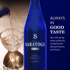 Saratoga signature cobalt blue bottles showcasing premium still water for travel.