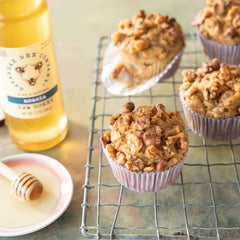 Savannah Bee honey drizzle over peaches, showcasing pairing of fruit and honey.