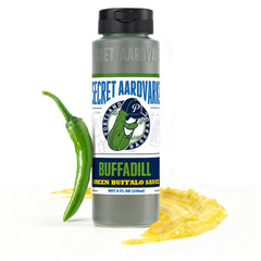 Secret Aardvark BuffaDill green bottle pour showcasing bold dill buffalo flavor for wings