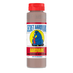 Secret Aardvark Habanero hot sauce bottle being poured for bold flavor
