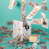 Send A Cake Celebration Billionaire Box with festive packaging and music sets a celebratory mood.