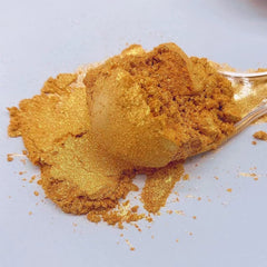 Shanlinly Gold Luster Dust applied with brush for cake accents.