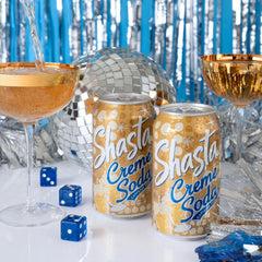 Ice-cold Shasta Creme Soda being poured for a refreshing serve.
