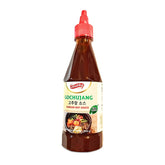 Shirakiku Gochujang bottle pouring sauce for quick flavor boost.