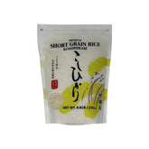 Shirakiku Koshihikari short-grain rice in an uncooked bag, ideal for sushi.