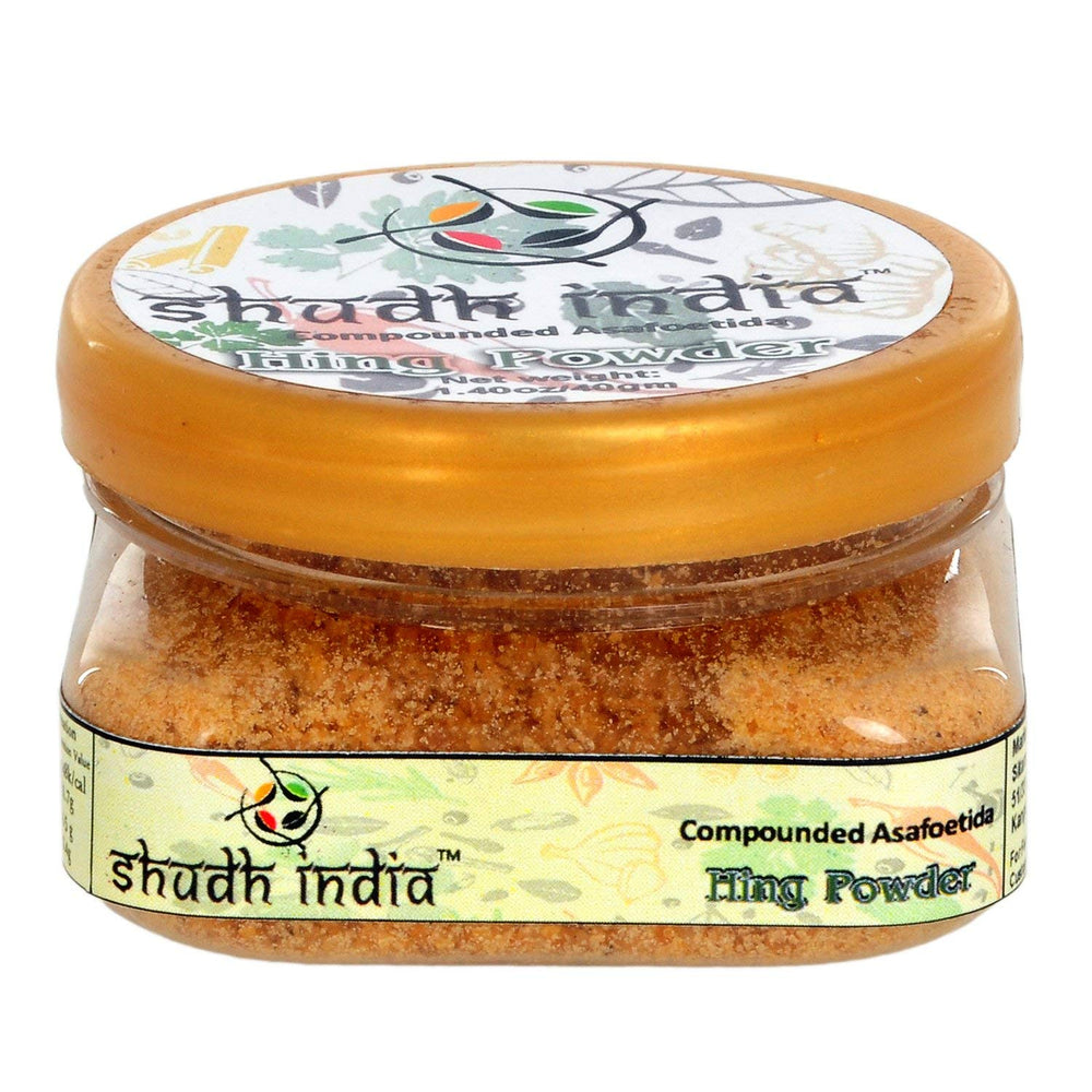 Shudh India Hing powder in a jar for authentic flavor in Indian cooking.