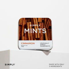 Holding a mint from Simply Gum for a mid-meal refresh
