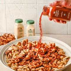 Spoon dispensing Simply Organic paprika ground for precise seasoning
