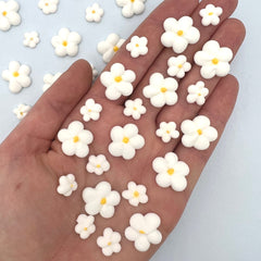 Simply Sucré Royal Icing Blossoms decorate a cake with color and elegance.