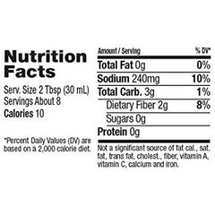 Skinnygirl Raspberry Vinaigrette bottle over salad, fruity brightness for meals