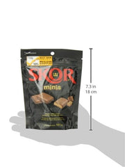 Skor Buttered Toffee Minis bar in hand—portable on-the-go indulgence.
