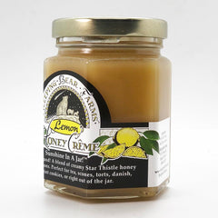 Spoonful of Lemon Crème Honey from Sleeping Bear Farms highlighting bright lemon aroma.