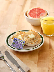Smucker's apple jelly half-ounce cups showcased, great for family breakfasts or catering.