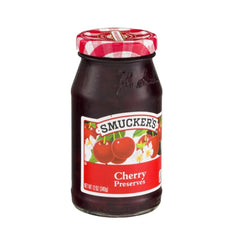 Smucker's Cherry Preserves jar close-up showing glossy spread, great on toast.