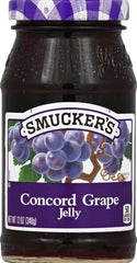 Closeup of Smucker's Concord Grape Jelly jar highlighting rich color and glossy texture