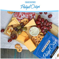 Snack Factory Pretzel Crisps dip-ready with hummus, ideal for quick appetizers.