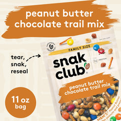 Trail mix being poured from Snak Club bag highlighting texture and variety
