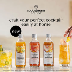 SodaStream Crafted Mixers White Peach Ginger pouring into a glass for a light mocktail